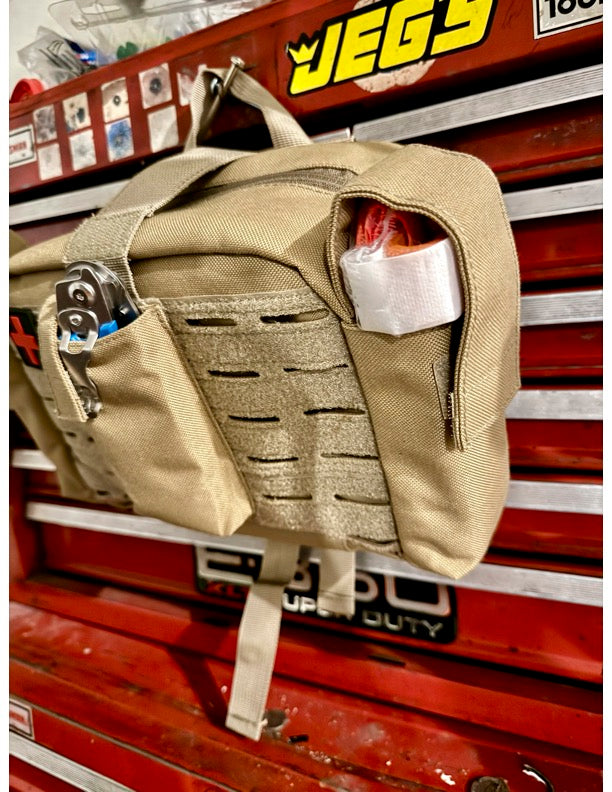 tan Police2Bag loaded trauma response bag showing exterior MOLLE design and rapid-access pockets