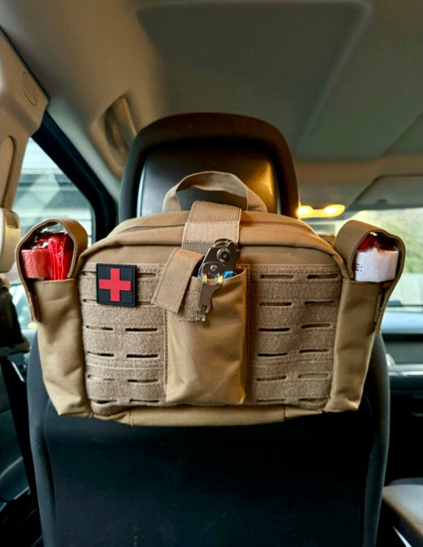 tan Police2Bag loaded trauma response bag in vehicle with rapid-access tourniquet pockets